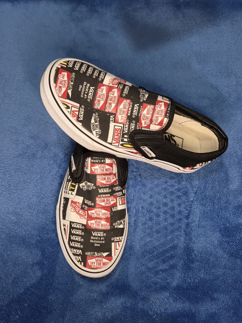 Vans Slip-On Skate Shoes in Black & White with Red Logo Print